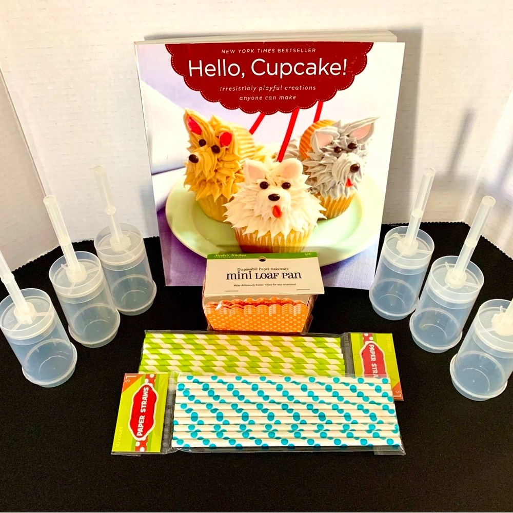 HELLO Cupcake decorating cook book with assorted baking supplies & pushup pops.